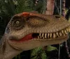 A person in a lab coat and goggles is playfully posing with a large model of a dinosaurs head