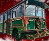 A vintage-style trolley is decorated with festive Christmas wreaths and bows set against a seasonal background with snowflake decorations