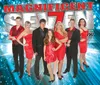 The image shows seven performers dressed in red and black smiling and posing for a promotional photo for their show titled Magnificent Seven