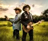 Three musicians stand confidently in front of a vintage blue pickup truck holding their guitars exuding a classic Americana vibe