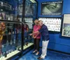 Visitors are examining a large underwater remotely operated vehicle ROV named ZEUS from Odyssey on display at a museum or exhibition